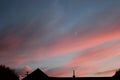 Fire sunset with hazy clouds and house