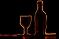 The fire traces around the glass and wine bottle Royalty Free Stock Photo