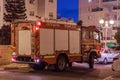 The fire truck arrived at night on an emergency call is on the street in Nahariyya city, Israel Royalty Free Stock Photo