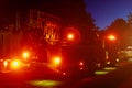 Fire truck with flashing lights, lighting in dusk Royalty Free Stock Photo