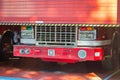 Fire truck in garage with door lifting up to attend to a public emergency or a fire in the neighborhood or in the city