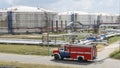 Fire truck in industrial plant. A large red fire rescue vehicle in the chemistry refinary plant. Fire safety concept