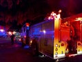 Fire Trucks lights flash on College Campus as they put out fire at night Royalty Free Stock Photo