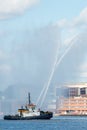 Fire tug boat in a harbor Royalty Free Stock Photo