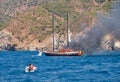 Fire on Turkish yacht in the Mediterranean Sea. The boat came to the rescue. The yacht is all on fire. Oludeniz,Fethiye,Mugla,Turk