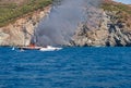 Fire on Turkish yacht in the Mediterranean Sea. A coast guard boat and two small boats came to the rescue. Oludeniz,Fethiye,Mugla,