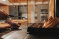 Fire up the fireplace.Glass fireplace in the interior of a cozy wooden chalet.Home fireplace ignition.hands hold a flint