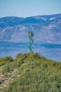 Fire vigilance tower over the hill with mountains in the background Royalty Free Stock Photo