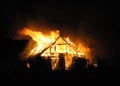 Fire village house at night. Royalty Free Stock Photo