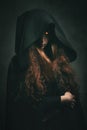 Fire witch with black robe Royalty Free Stock Photo