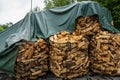 Fire wood packed in sacks on pallets.. Royalty Free Stock Photo