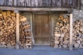 Fire Wood Stacked Outside Barn Door