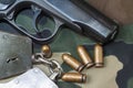 Firearm Pistol And Hand Gun Ammunition on military camouflage background