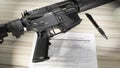 Firearm purchase background check form and AR-15 Royalty Free Stock Photo