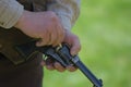 Reenactor loads replica gun