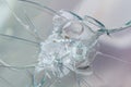 Firearms bullethole on the glass from the bullets, cracks background Royalty Free Stock Photo