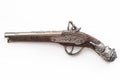 Firearms dating to the american revolution and antique collectables concept with ornate old fashioned dueling flintlock pistol Royalty Free Stock Photo