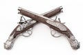 Firearms dating to the american revolution and antique collectables concept with ornate old fashioned dueling flintlock pistols Royalty Free Stock Photo