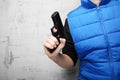 Firearms for self-defense. Black pistol in male hand