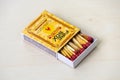 A firebox match with match sticks on wooden background Royalty Free Stock Photo