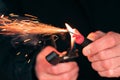 Firecracker Burning in Hand with Sparks and Smoke Royalty Free Stock Photo