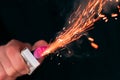 Firecracker Burning in Hand with Sparks and Smoke Royalty Free Stock Photo