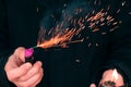 Firecracker Burning in Hand with Sparks and Smoke Royalty Free Stock Photo