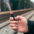 Firecracker Burning in Hand with Sparks and Smoke Royalty Free Stock Photo