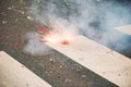 Firecracker exploding on the asphalt of a street Royalty Free Stock Photo