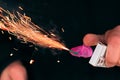 Firecracker Burning in Hand with Sparks and Smoke Royalty Free Stock Photo