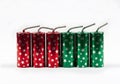 firecrackers in cylindrical shape, various colors and star patterns, in a row, New Year celebration Royalty Free Stock Photo