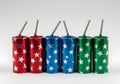 firecrackers in cylindrical shape, various colors and star patterns, in a row, New Year celebration Royalty Free Stock Photo
