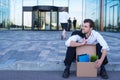 Fired businessman sitting on street Royalty Free Stock Photo