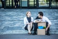 Fired businessman sitting on street Royalty Free Stock Photo