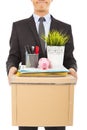 Fired businessman felling sad and belongings Royalty Free Stock Photo