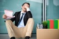 Fired businessman reading the notice of job termination Royalty Free Stock Photo