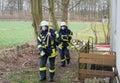 Firefighter in action and extinguish with a fire hose - Serie Firefighter