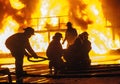 Firefighter adjusting firehose during a firefighting exercise Royalty Free Stock Photo