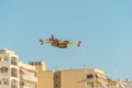 Firefighter airplane above city Royalty Free Stock Photo