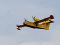 Firefighter airplane, water bomber, air tank taking water from t