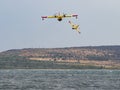 Firefighter airplane, water bomber, air tank taking water from t