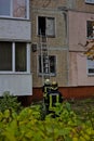 A firefighter climbs an easy staircase to the second floor of a residential building to extinguish the fire.