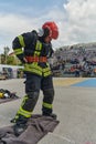 A firefighter dons the essential components of their professional gear, embodying resilience, commitment, and readiness Royalty Free Stock Photo