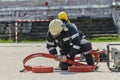 A firefighter dons the essential components of their professional gear, embodying resilience, commitment, and readiness Royalty Free Stock Photo