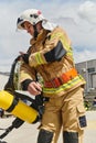 A firefighter dons the essential components of their professional gear, embodying resilience, commitment, and readiness Royalty Free Stock Photo
