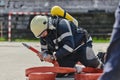 A firefighter dons the essential components of their professional gear, embodying resilience, commitment, and readiness Royalty Free Stock Photo