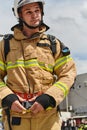 A firefighter dons the essential components of their professional gear, embodying resilience, commitment, and readiness Royalty Free Stock Photo