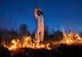 Firefighter ecologist working in field with wildfire. Royalty Free Stock Photo