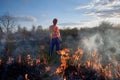 Firefighter ecologist working in field with wildfire. Royalty Free Stock Photo