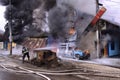 Firefighter extinguish a burning car